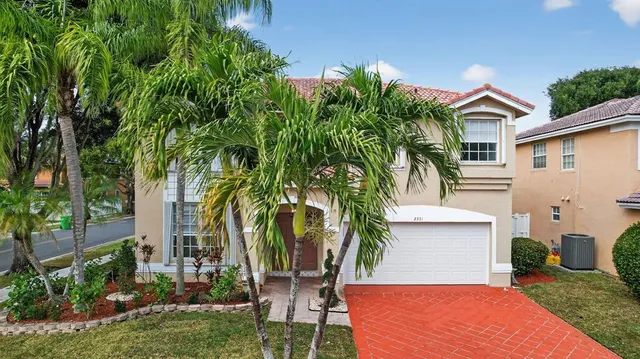 an aerial view of city and lake