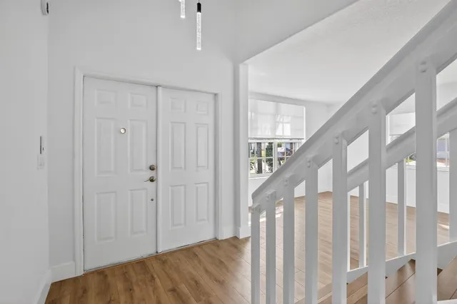 a view of a hallway with staircase