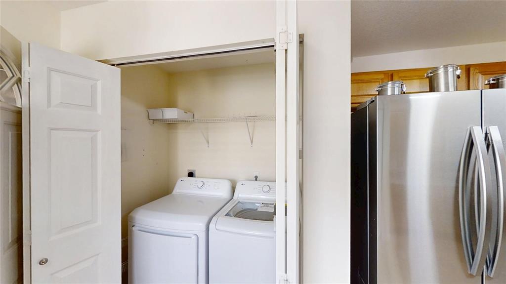 9761 Southwest 90th Street Ocala, FL 34481 - Photo 13 of 27 a utility room with dryer and washer