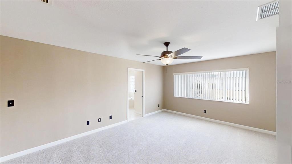 9761 Southwest 90th Street Ocala, FL 34481 - Photo 16 of 27 a view of an empty room with a window