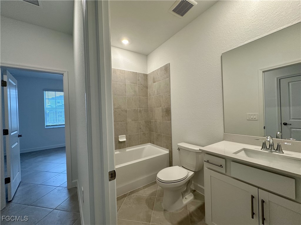 15084 Anchorage Road Punta Gorda, FL 33982 - Photo 16 of 30 a bathroom with a sink a toilet and shower