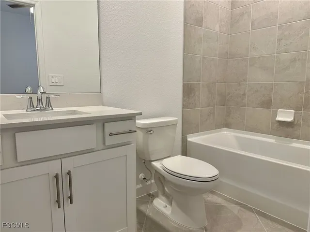 a bathroom with a sink a toilet and a bathtub