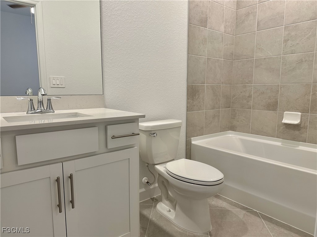 15084 Anchorage Road Punta Gorda, FL 33982 - Photo 17 of 30 a bathroom with a sink a toilet and a bathtub