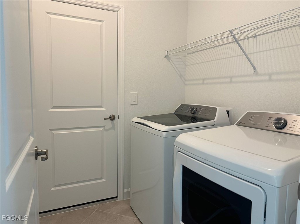15084 Anchorage Road Punta Gorda, FL 33982 - Photo 23 of 30 a utility room with dryer and washer