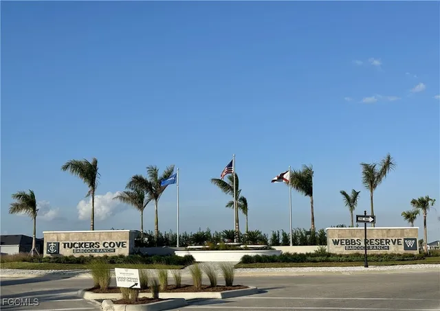 a view of outdoor space with signage and flags