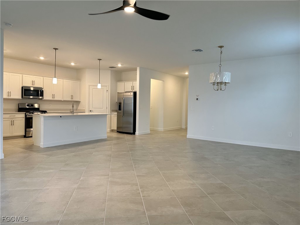 15084 Anchorage Road Punta Gorda, FL 33982 - Photo 8 of 30 a view of kitchen with refrigerator and window