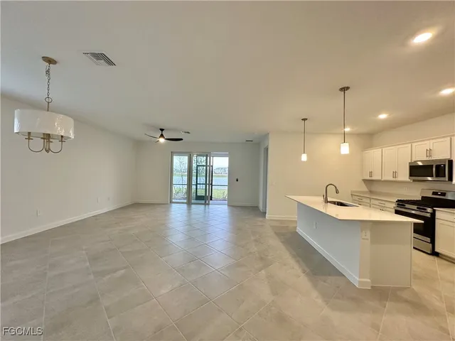 a view of a kitchen with microwave and stove