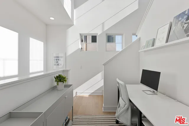 a workspace with furniture and window