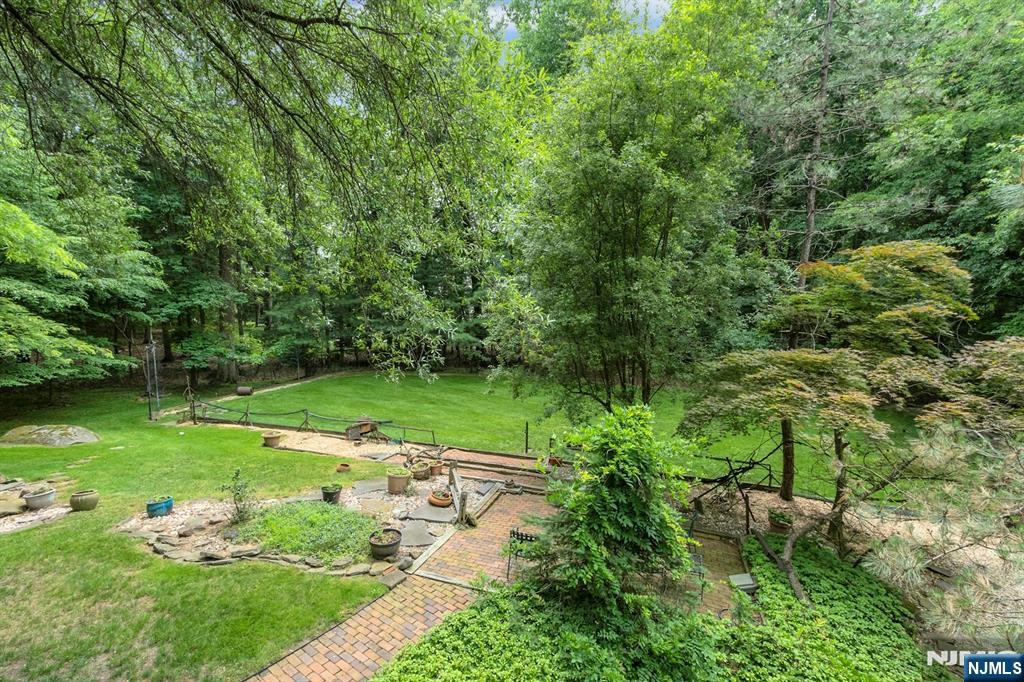 34 Cambridge Way Alpine, NJ 07620 - Photo 47 of 48 a view of a golf course with a garden