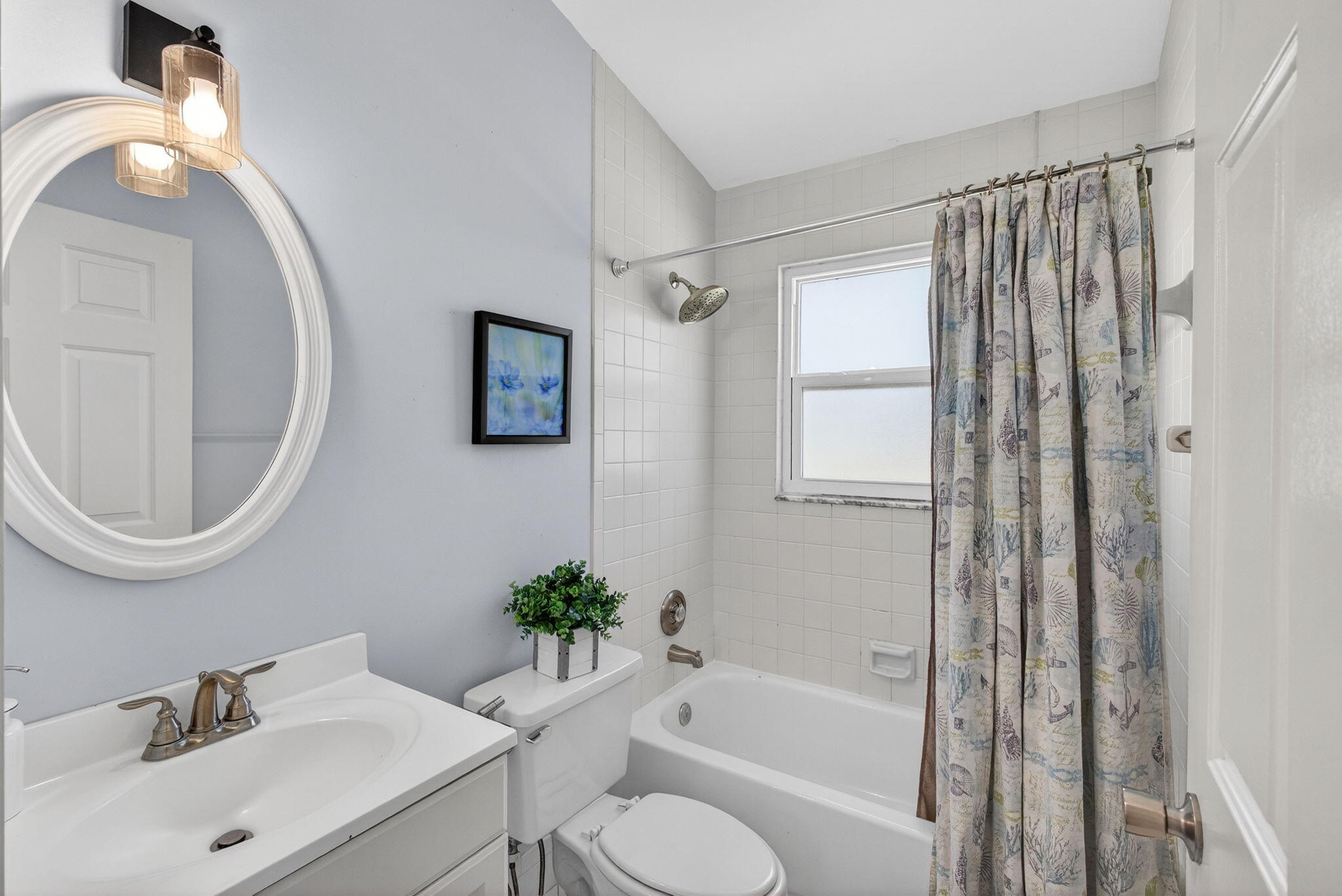 6223 Kendrick Street Jupiter, FL 33458 - Photo 13 of 45 a bathroom with a sink toilet and shower