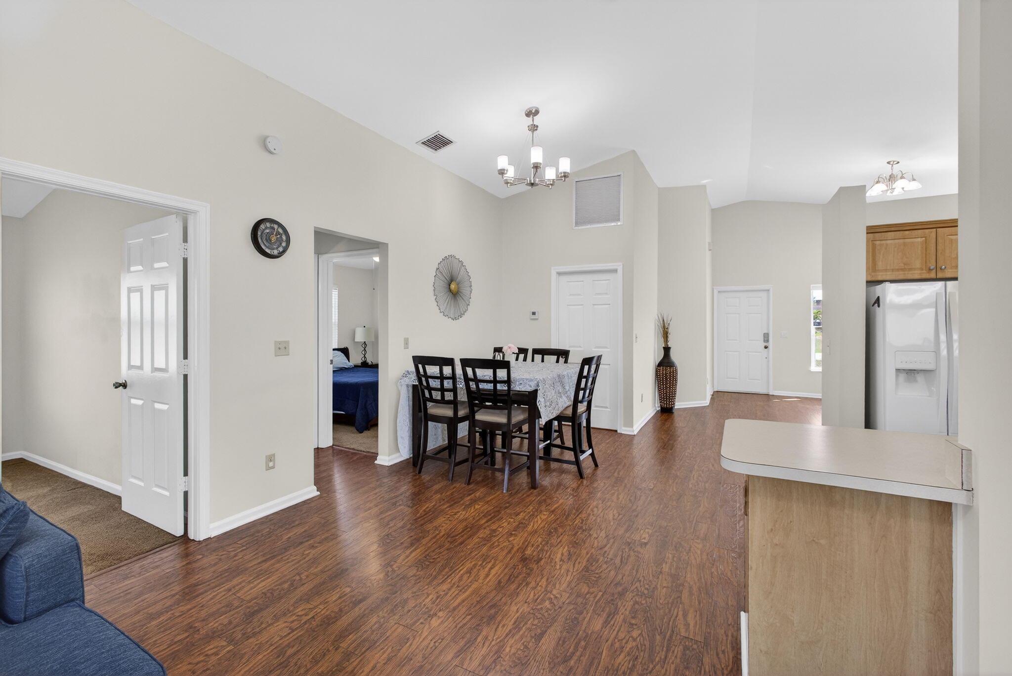 6223 Kendrick Street Jupiter, FL 33458 - Photo 19 of 45 a view of a dining room with furniture and wooden floor