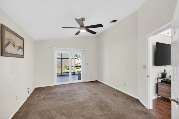 a view of a livingroom with an empty space and a window