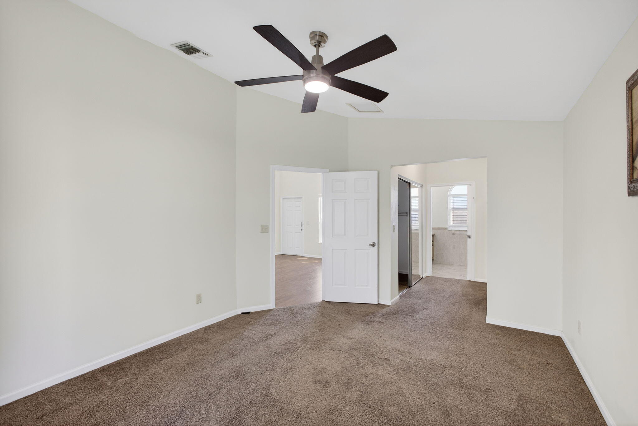 6223 Kendrick Street Jupiter, FL 33458 - Photo 23 of 45 an empty room with closet and windows