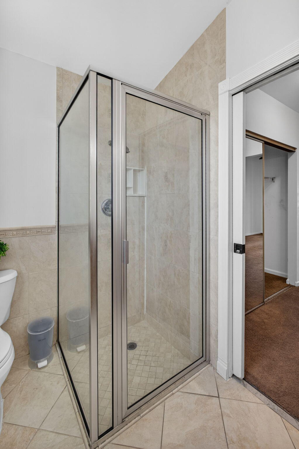 6223 Kendrick Street Jupiter, FL 33458 - Photo 27 of 45 a bathroom that has a glass shower door
