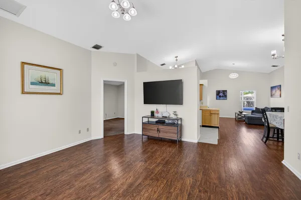 a room with furniture and a flat screen tv