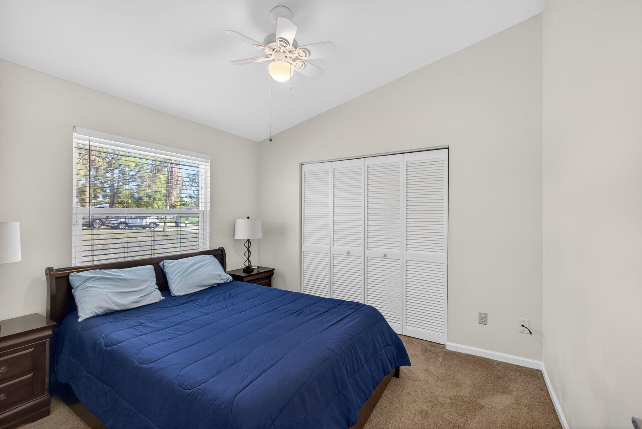6223 Kendrick Street Jupiter, FL 33458 - Photo 33 of 45 a bedroom with a large bed and a window