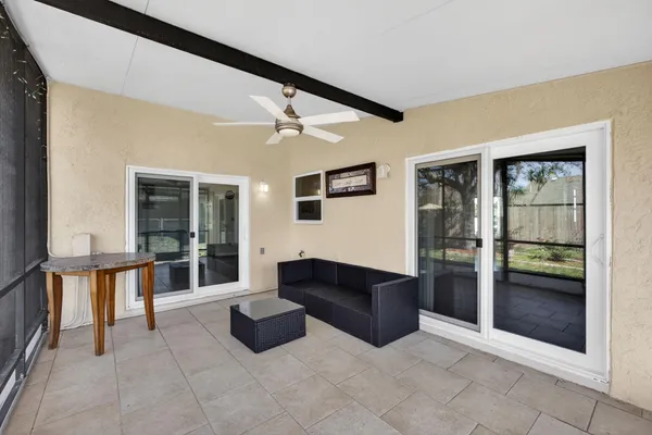 a view of a porch with furniture and window