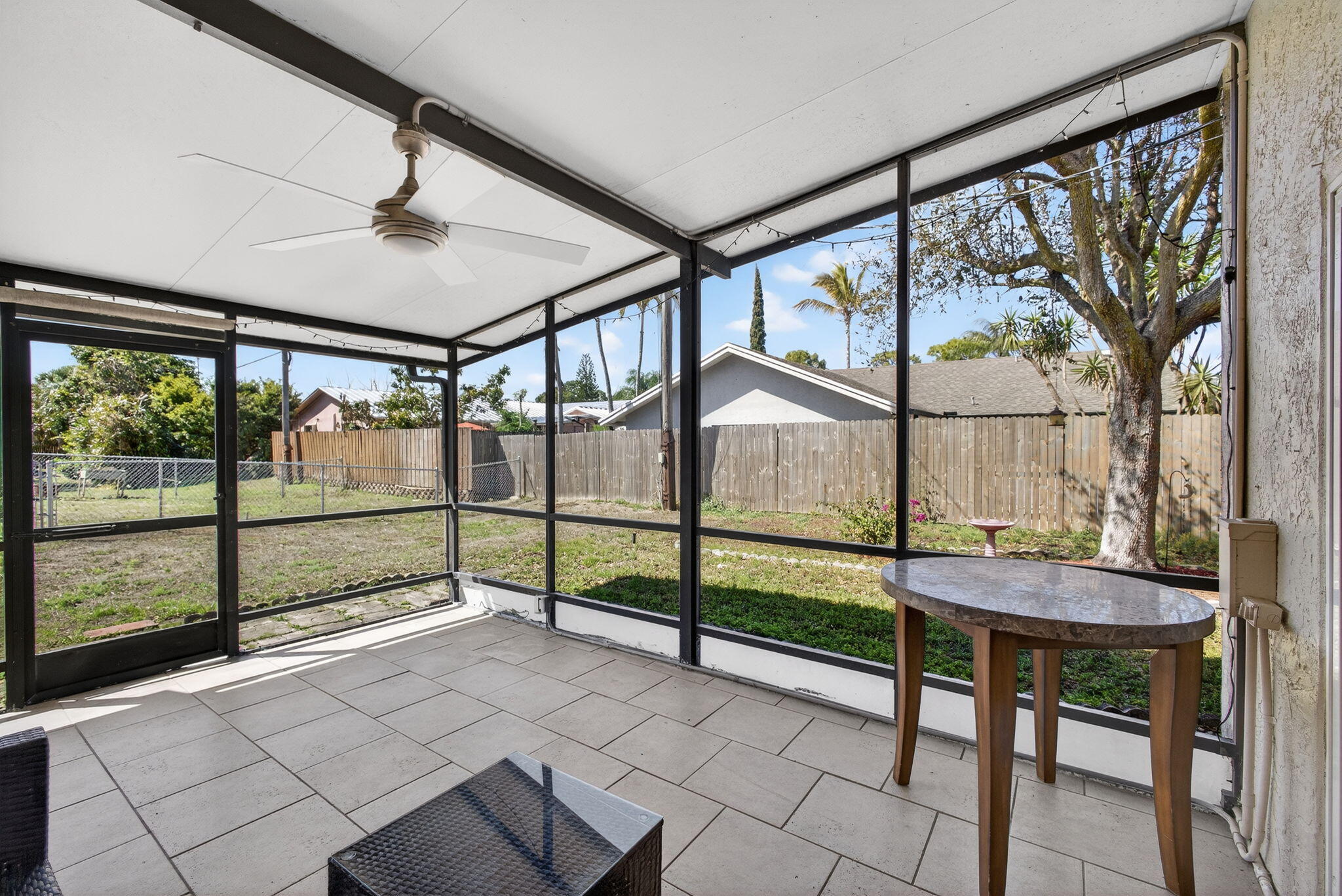 6223 Kendrick Street Jupiter, FL 33458 - Photo 37 of 45 a view of a porch with furniture and window