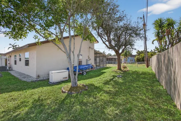 a view of a backyard with garden and plants