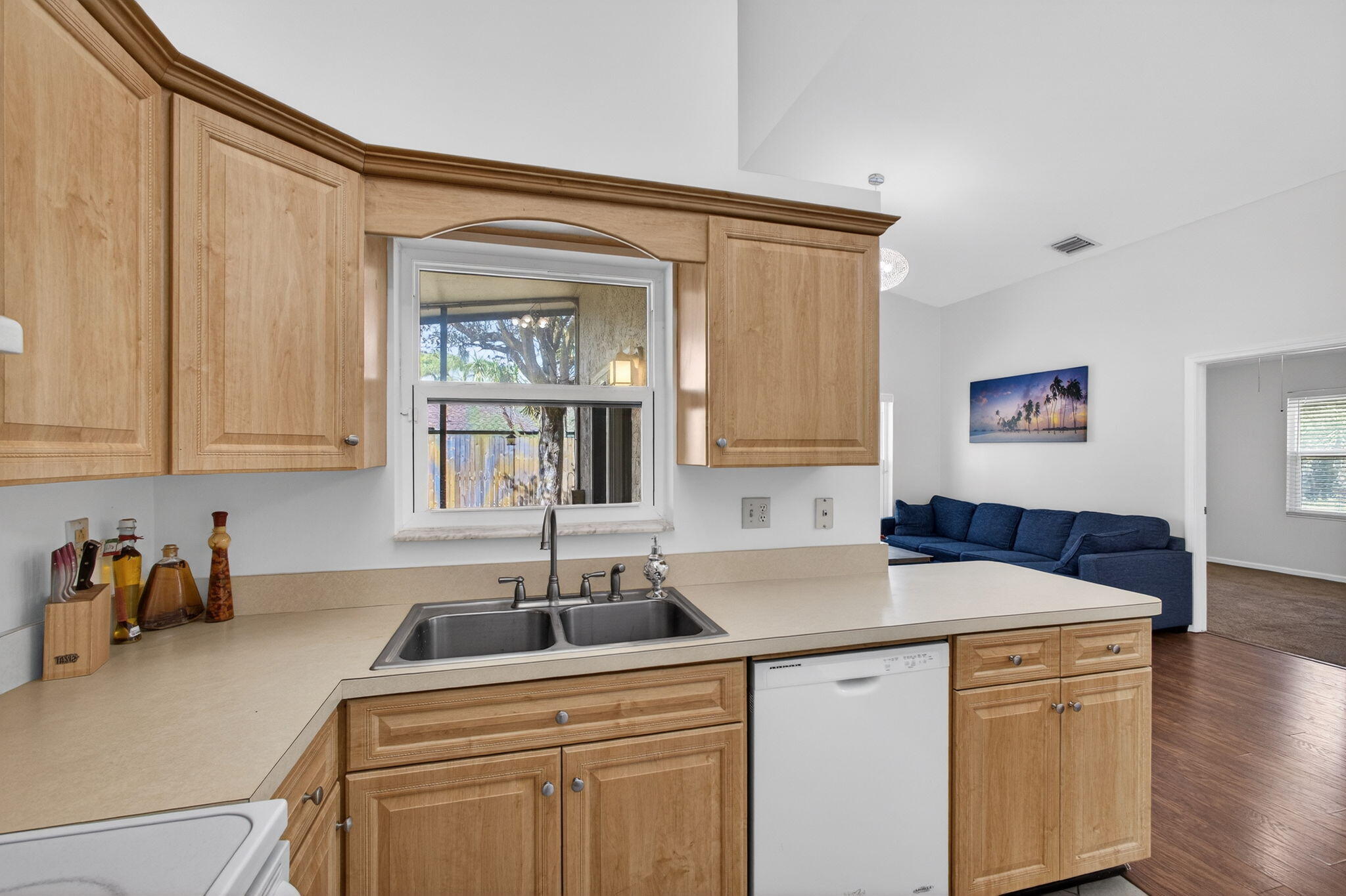 6223 Kendrick Street Jupiter, FL 33458 - Photo 7 of 45 a kitchen with a sink cabinets and wooden floor