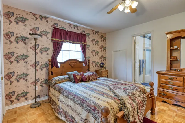 a bedroom with a bed and a window