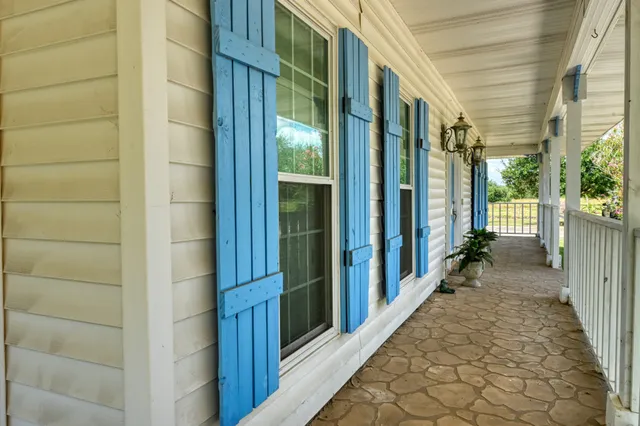 a view of a brick house with a large window