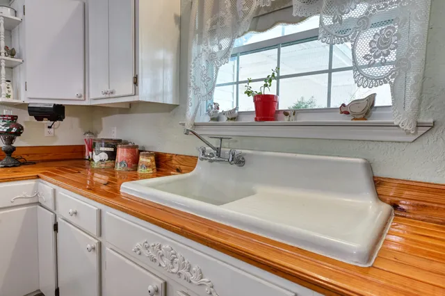 a kitchen with sink and window