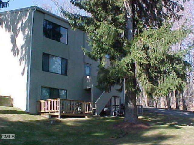 88 Olcott Way Ridgefield, CT 06877 - Photo 1 of 1 a front view of a house with a yard
