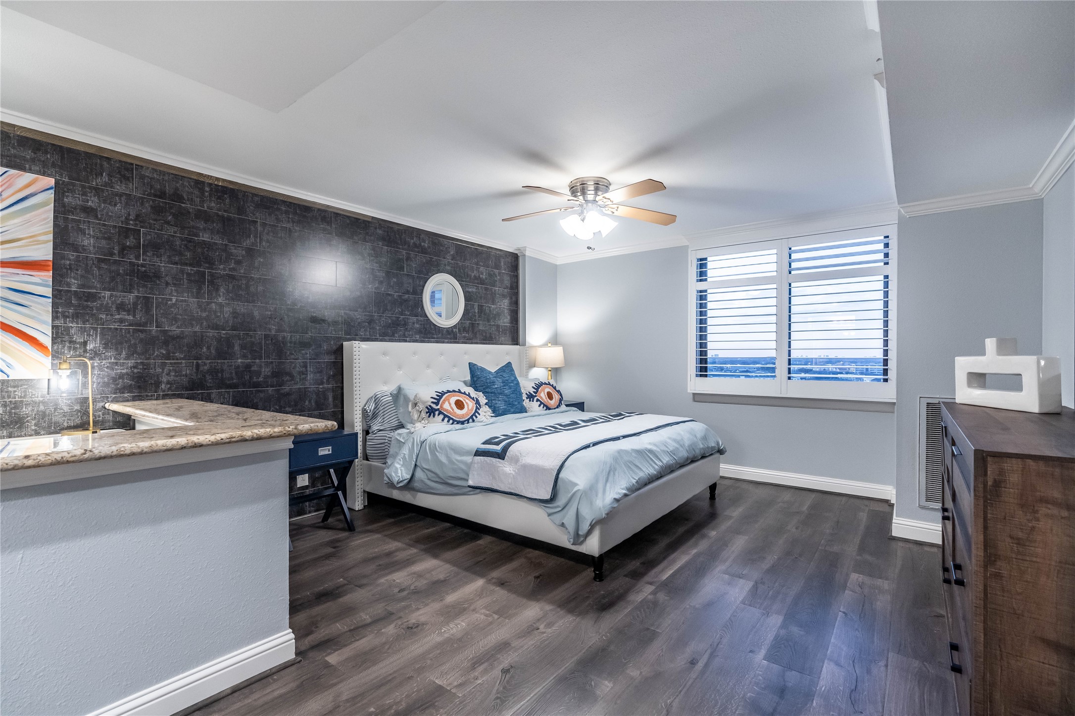 3525 Sage Road, Unit 1511 Houston, TX 77056 - Photo 10 of 25 a bedroom with a bed and a chandelier