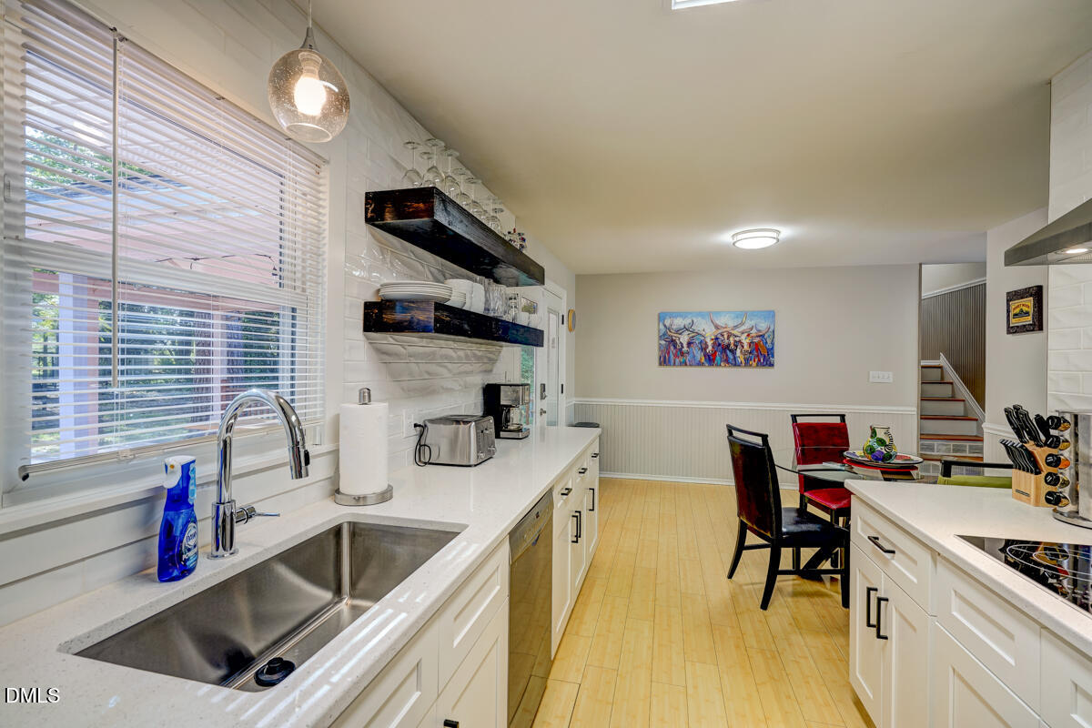 3418 Huntleigh Drive Raleigh, NC 27604 - Photo 28 of 55 a kitchen that has a sink and a stove