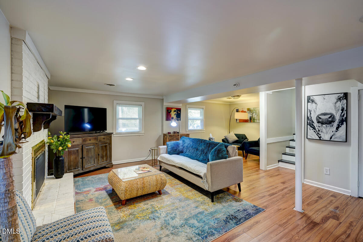 3418 Huntleigh Drive Raleigh, NC 27604 - Photo 32 of 55 a living room with furniture and a flat screen tv