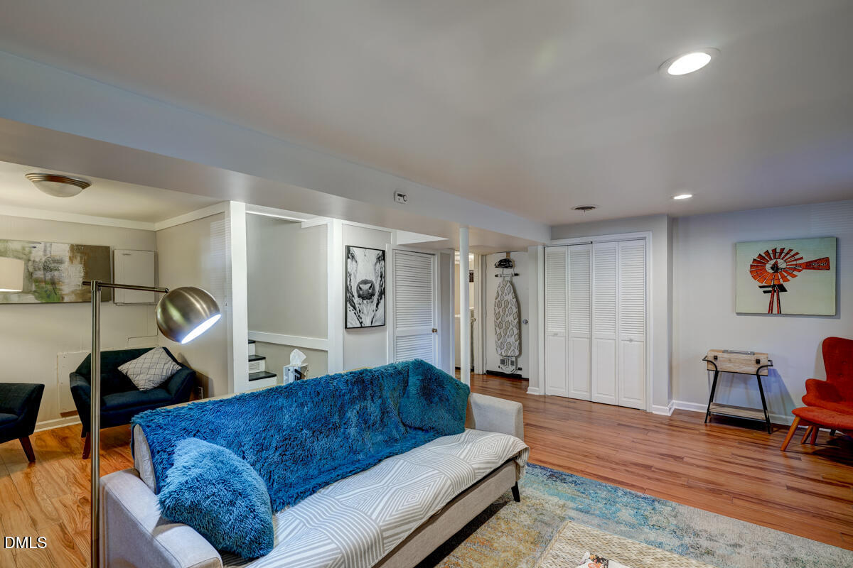 3418 Huntleigh Drive Raleigh, NC 27604 - Photo 33 of 55 a living room with furniture and a wooden floor