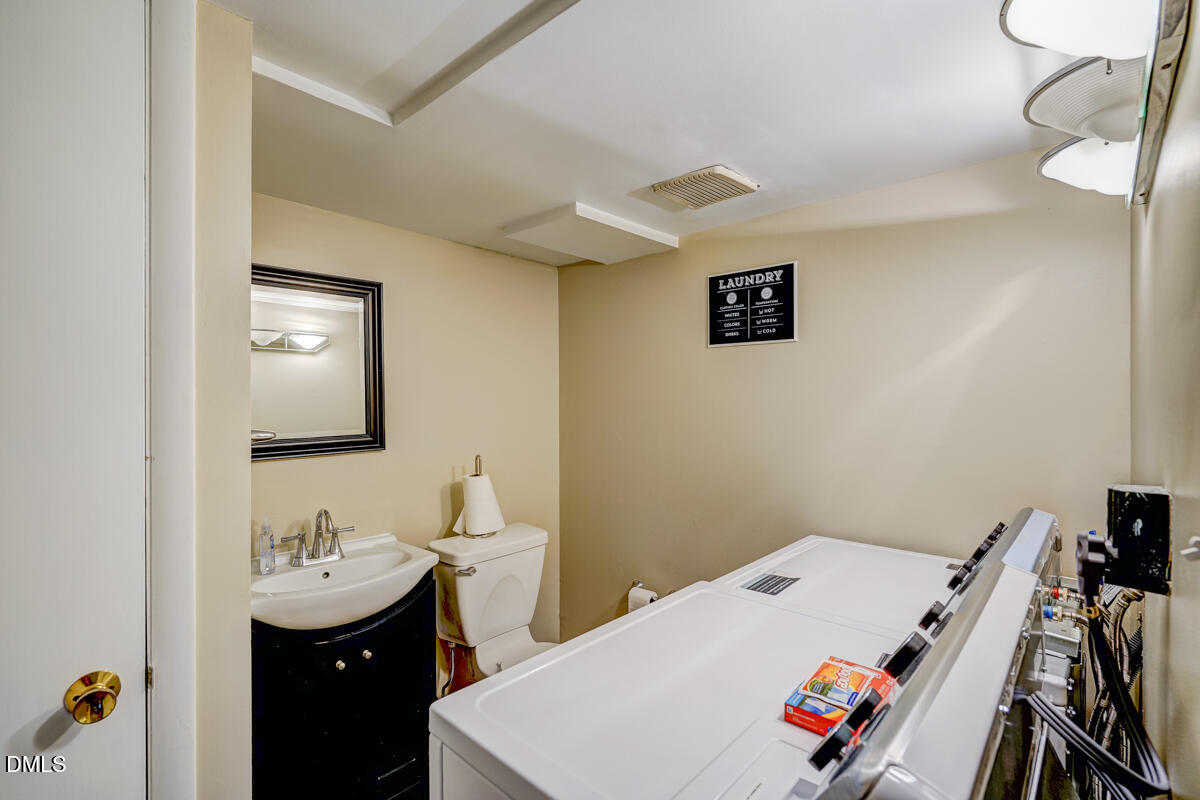 3418 Huntleigh Drive Raleigh, NC 27604 - Photo 35 of 55 a bathroom with a sink and a mirror