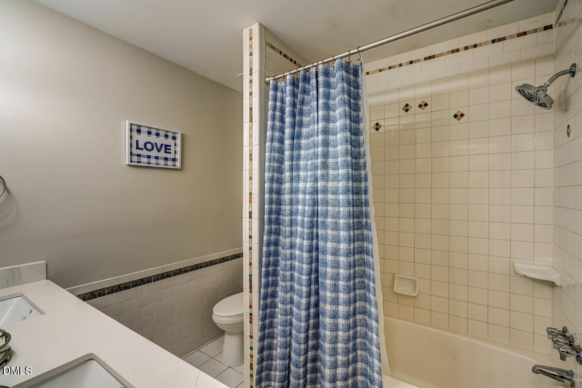 3418 Huntleigh Drive Raleigh, NC 27604 - Photo 41 of 55 a bathroom with a shower and a toilet