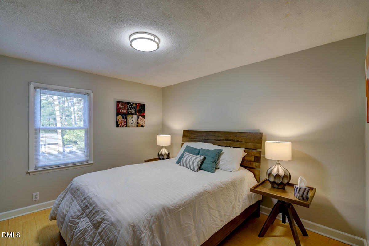 3418 Huntleigh Drive Raleigh, NC 27604 - Photo 46 of 55 a bedroom with a bed and a window