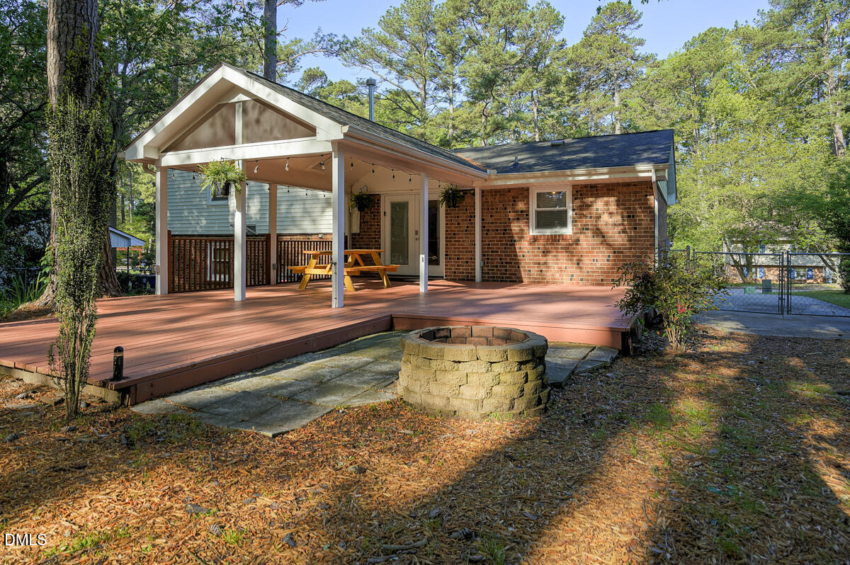 3418 Huntleigh Drive Raleigh, NC 27604 - Photo 50 of 55 a view of a house with swimming pool and sitting area