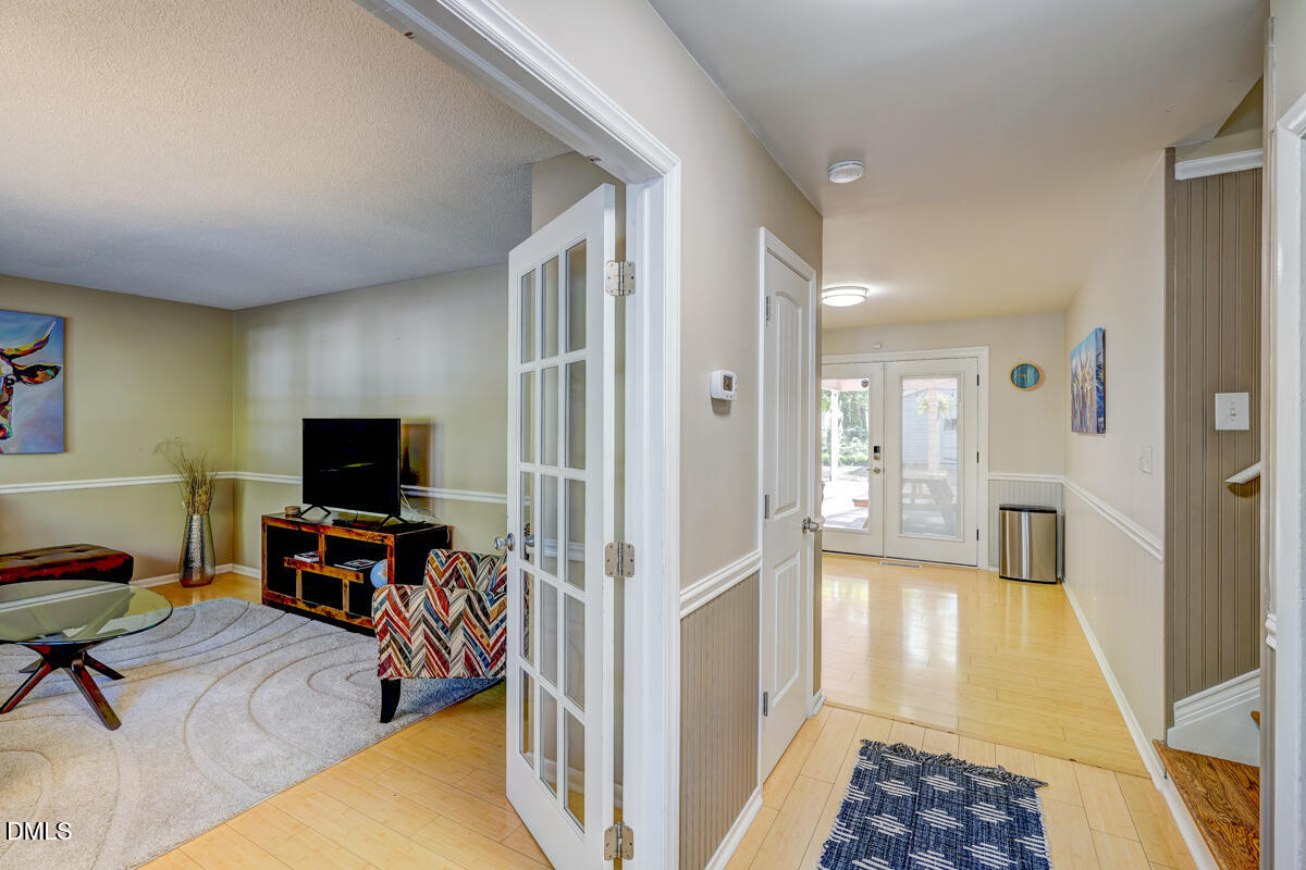 3418 Huntleigh Drive Raleigh, NC 27604 - Photo 5 of 55 a view of a livingroom with furniture and a flat screen tv