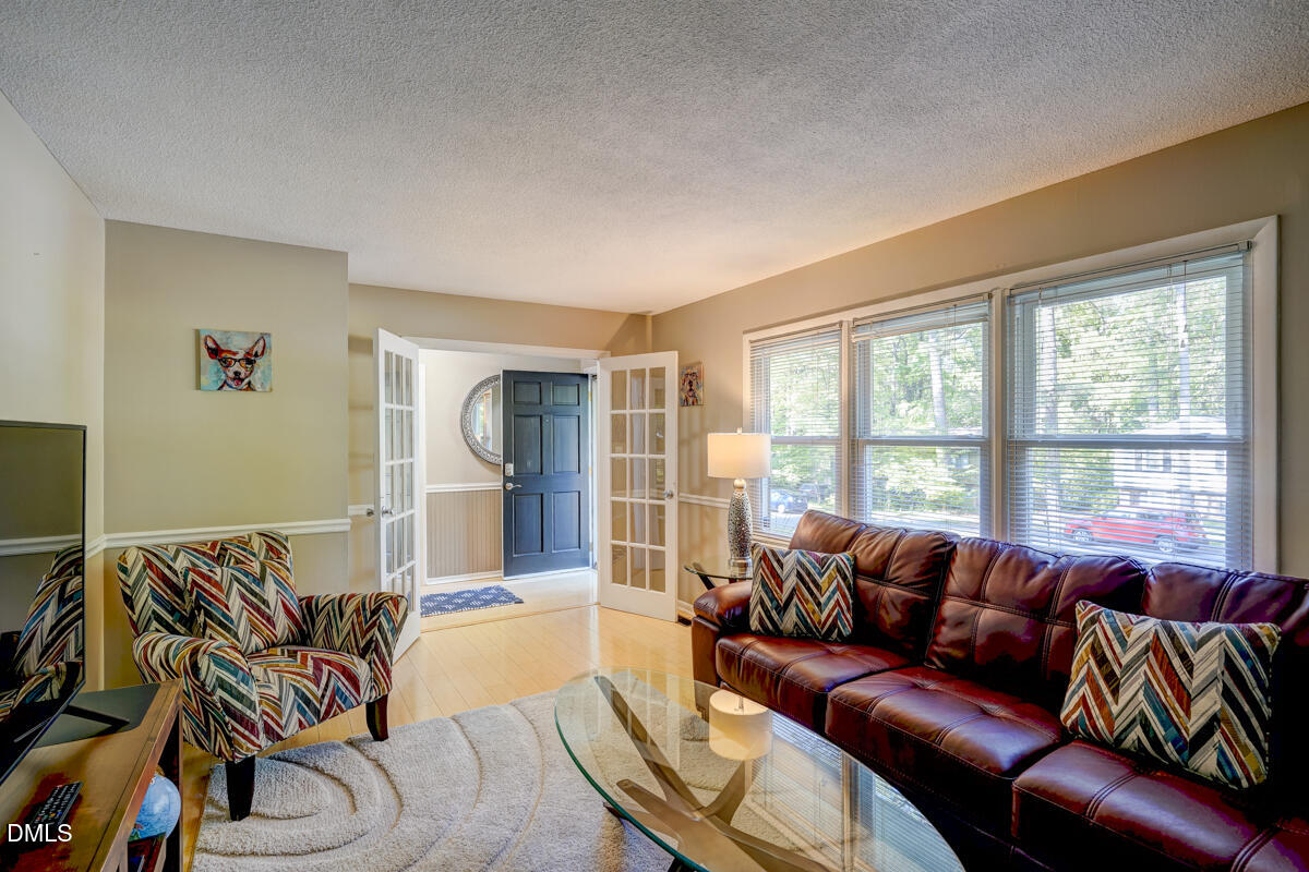 3418 Huntleigh Drive Raleigh, NC 27604 - Photo 10 of 55 a living room with furniture and a large window