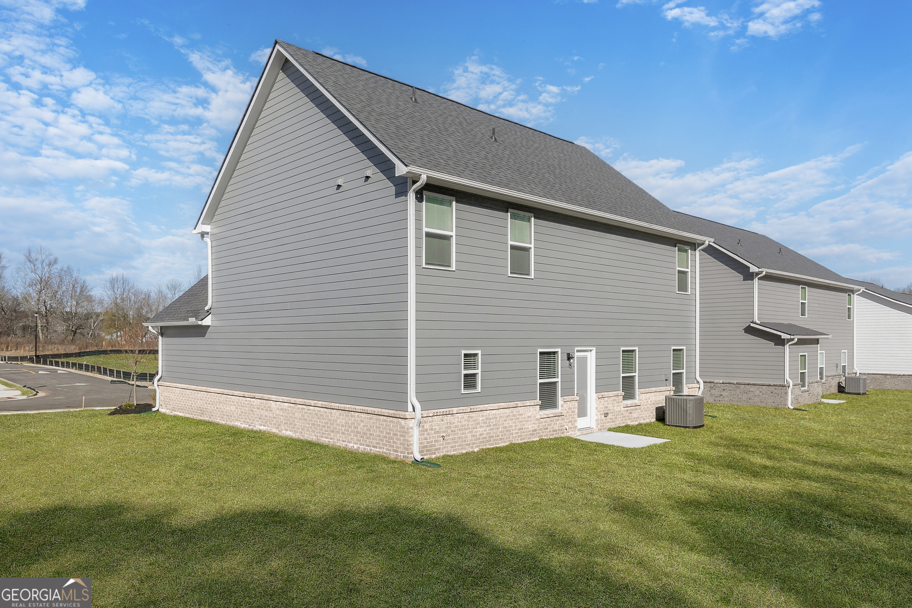 161 Sunfish Circle Hoschton, GA 30548 - Photo 13 of 13 a view of a house with a yard