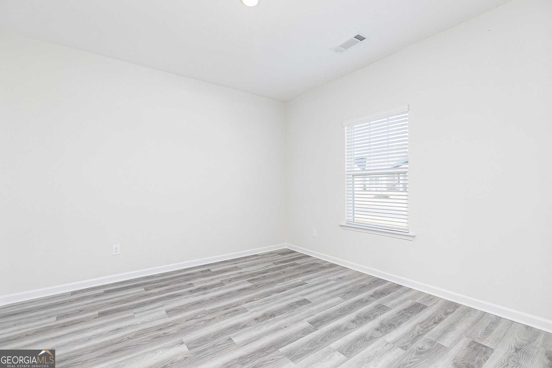 161 Sunfish Circle Hoschton, GA 30548 - Photo 2 of 13 an empty room with a window