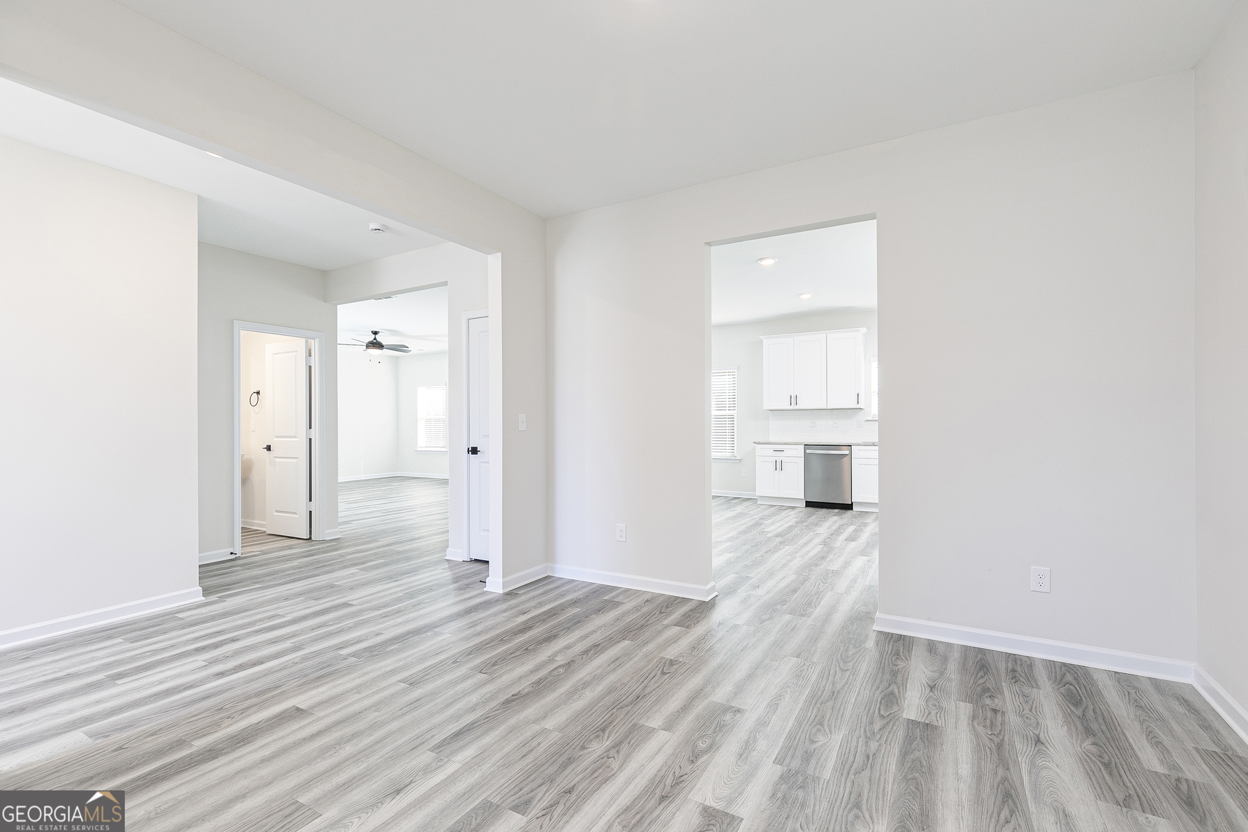 161 Sunfish Circle Hoschton, GA 30548 - Photo 3 of 13 a view of a room with wooden floor and a window