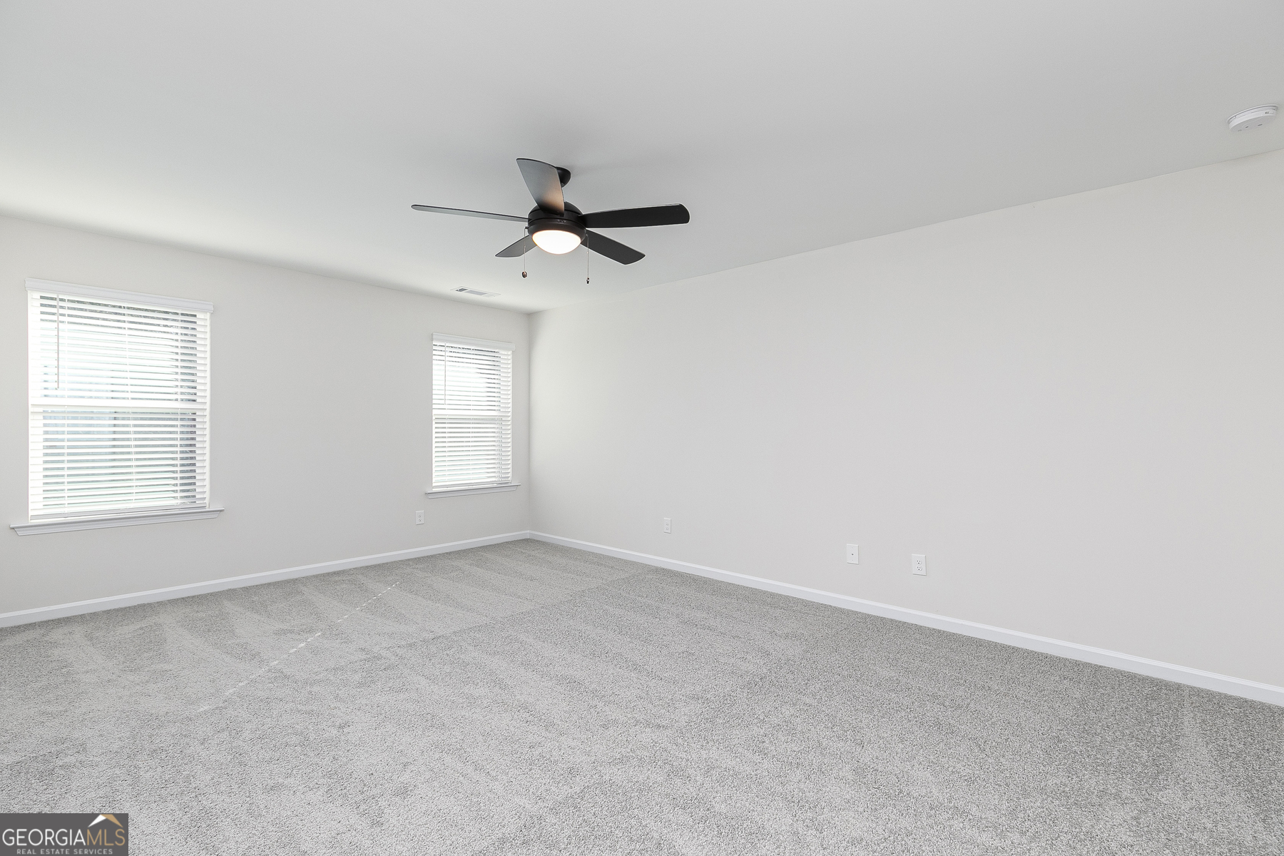 161 Sunfish Circle Hoschton, GA 30548 - Photo 7 of 13 a view of an empty room with a window