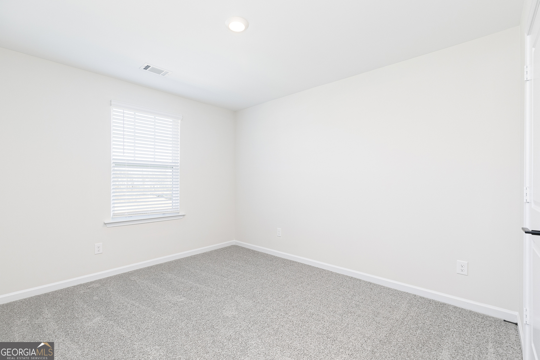 161 Sunfish Circle Hoschton, GA 30548 - Photo 10 of 13 an empty room with a window