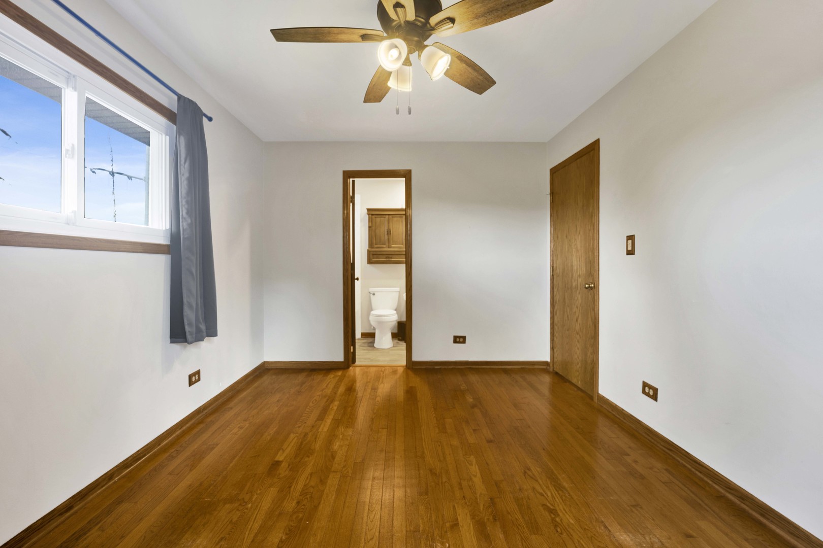 2S224 Valley Road Lombard, IL 60148 - Photo 20 of 37 a view of an empty room with chandelier fan and a window