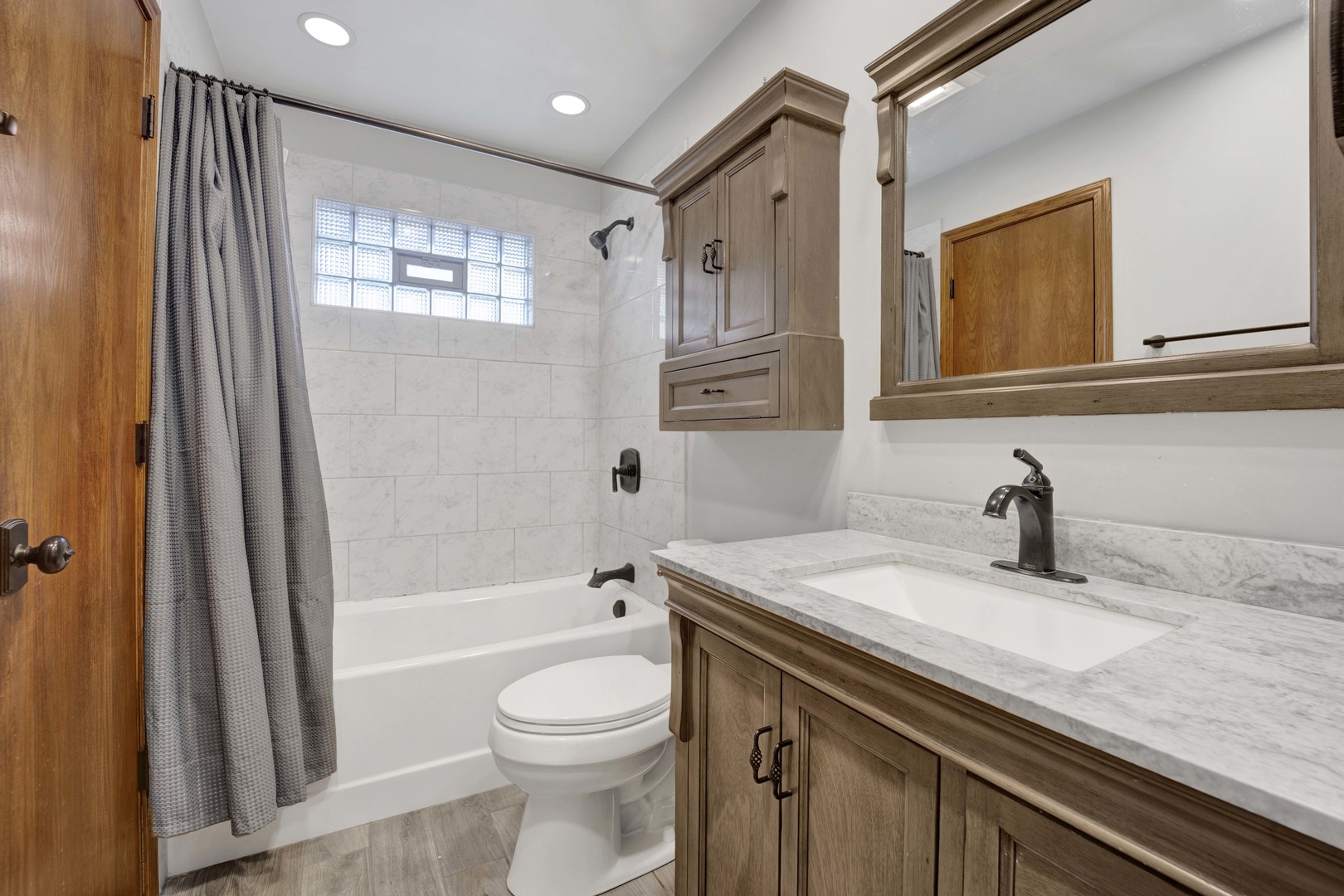 2S224 Valley Road Lombard, IL 60148 - Photo 21 of 37 a bathroom with a granite countertop sink toilet and shower
