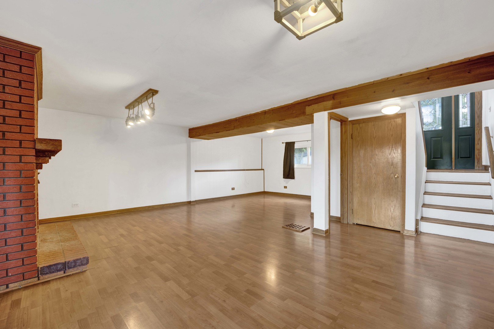 2S224 Valley Road Lombard, IL 60148 - Photo 26 of 37 a view of an empty room with wooden floor and a window