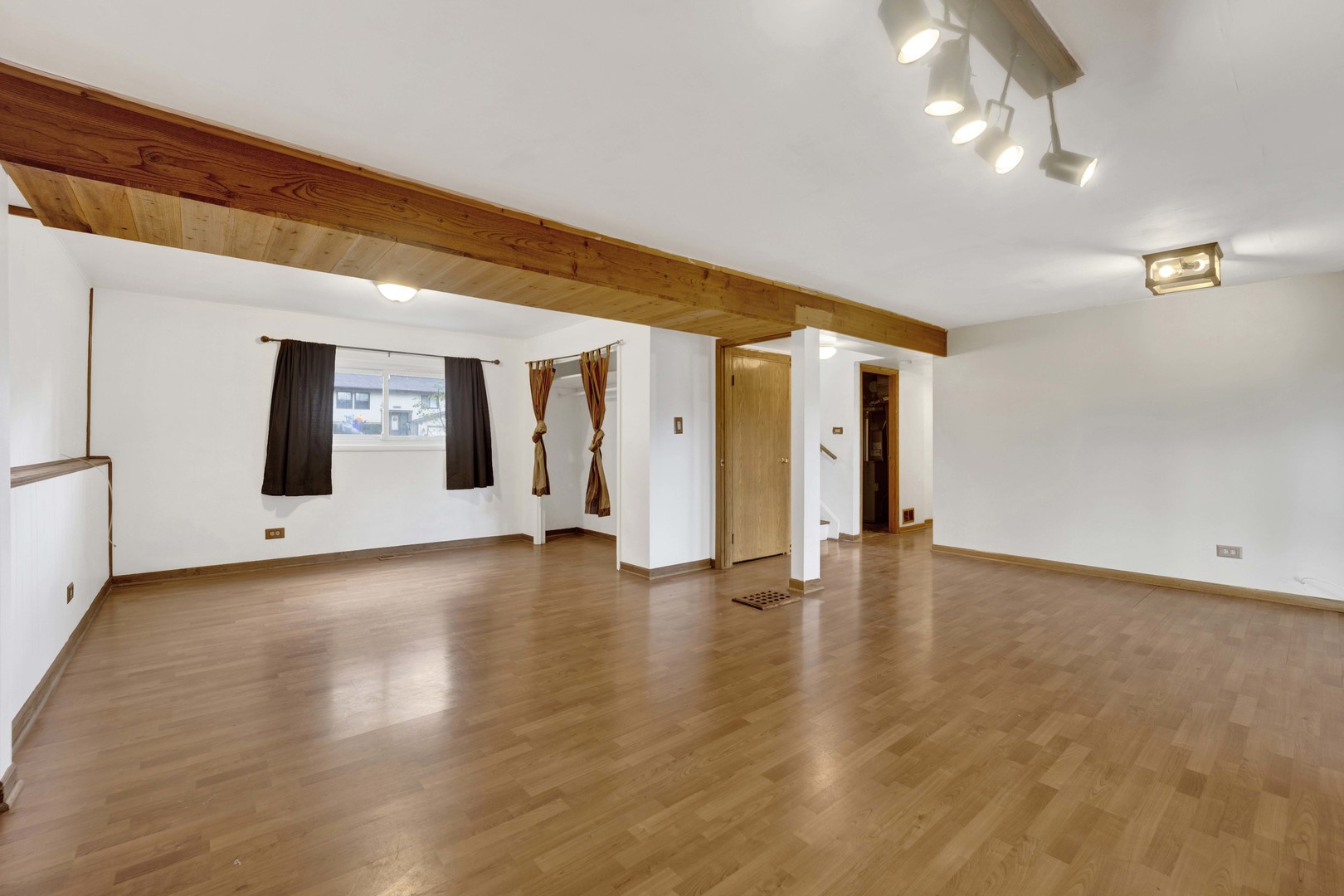 2S224 Valley Road Lombard, IL 60148 - Photo 27 of 37 a view of an empty room with window and wooden floor