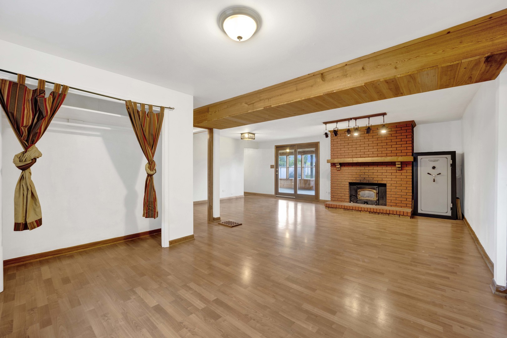 2S224 Valley Road Lombard, IL 60148 - Photo 28 of 37 a view of a livingroom with wooden floor and a fireplace