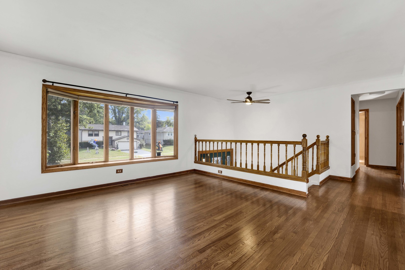 2S224 Valley Road Lombard, IL 60148 - Photo 3 of 37 a view of an empty room with wooden floor and a window