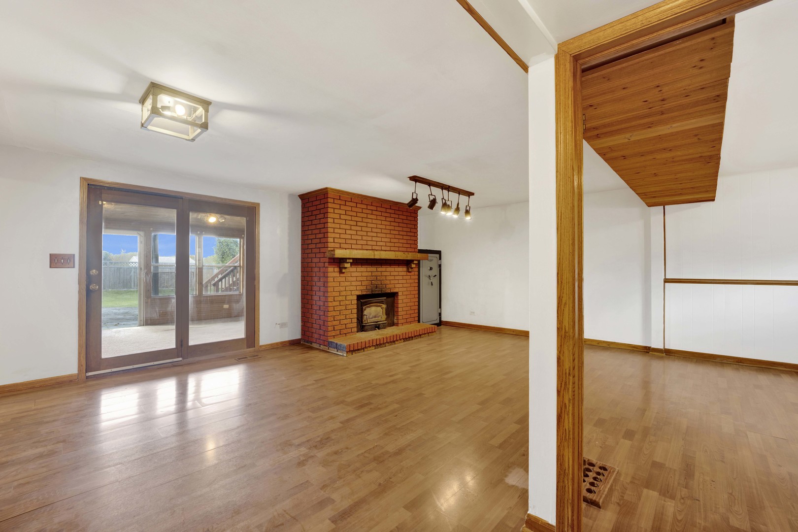 2S224 Valley Road Lombard, IL 60148 - Photo 32 of 37 a view of a livingroom with wooden floor and a fireplace